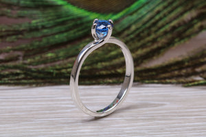 Silver solitaire ring with four claw twist setting of beautiful round royal blue sapphire C Z