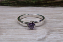 Load image into Gallery viewer, Silver solitaire twist style ring set with beautiful round Amethyst C Z