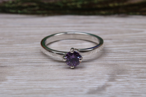 Silver solitaire twist style ring set with beautiful round Amethyst C Z