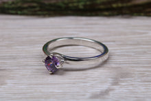 Load image into Gallery viewer, Silver solitaire twist style ring set with beautiful round Amethyst C Z