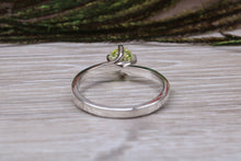 Load image into Gallery viewer, Silver solitaire twist style ring set with beautiful round Peridot C Z,ideal as promise, engagement or even dress ring.