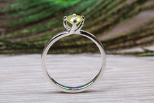 Load image into Gallery viewer, Silver solitaire twist style ring set with beautiful round Peridot C Z,ideal as promise, engagement or even dress ring.