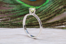 Load image into Gallery viewer, Silver solitaire twist style ring set with beautiful round Peridot C Z,ideal as promise, engagement or even dress ring.