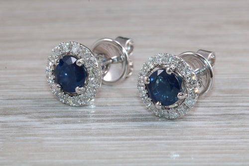 One carat each Blue Sapphire and Diamond Halo set Earrings