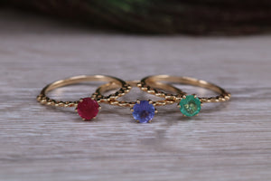 Dainty set of Three Tanzanite, Ruby and Emerald set Rings