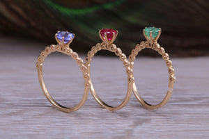 Dainty set of Three Tanzanite, Ruby and Emerald set Rings