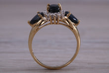 Load image into Gallery viewer, Beautiful Blue Sapphire and Diamond cluster dress ring, dark blue Sapphire with top white grade diamonds set in 9ct Yellow gold