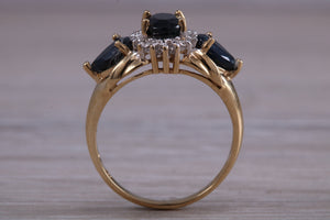 Beautiful Blue Sapphire and Diamond cluster dress ring, dark blue Sapphire with top white grade diamonds set in 9ct Yellow gold