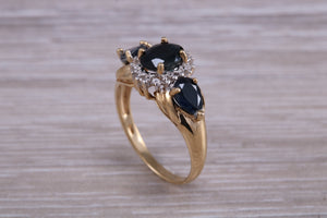 Beautiful Blue Sapphire and Diamond cluster dress ring, dark blue Sapphire with top white grade diamonds set in 9ct Yellow gold