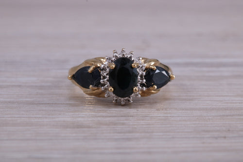 Beautiful Blue Sapphire and Diamond cluster dress ring, dark blue Sapphire with top white grade diamonds set in 9ct Yellow gold