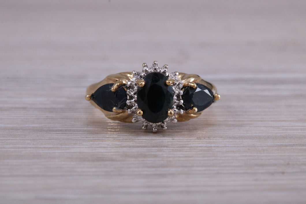 Beautiful Blue Sapphire and Diamond cluster dress ring, dark blue Sapphire with top white grade diamonds set in 9ct Yellow gold