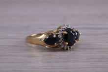Load image into Gallery viewer, Beautiful Blue Sapphire and Diamond cluster dress ring, dark blue Sapphire with top white grade diamonds set in 9ct Yellow gold