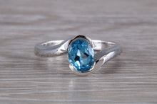 Load image into Gallery viewer, Oval cut Blue Topaz set Crossover Ring
