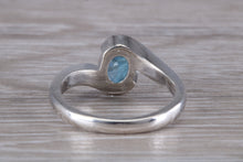 Load image into Gallery viewer, Oval cut Blue Topaz set Crossover Ring