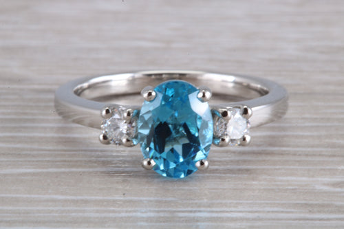 Blue Topaz and Diamond set Platinum Trilogy Ring