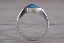 Load image into Gallery viewer, Oval cut Blue Topaz set Crossover Ring