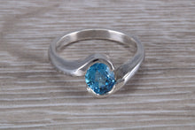 Load image into Gallery viewer, Oval cut Blue Topaz set Crossover Ring