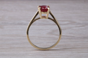 Two carat Oval cut Ruby set Yellow Gold Solitaire