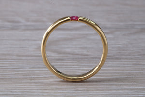 Tension set Natural Ruby Gold Band