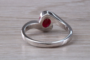 Oval cut Ruby set Crossover Ring