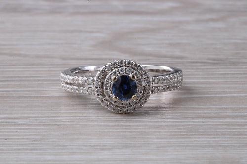 Blue Sapphire and Double Halo set Diamond Ring