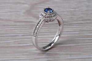 Blue Sapphire and Double Halo set Diamond Ring