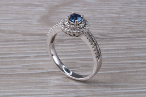 Blue Sapphire and Double Halo set Diamond Ring