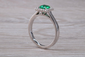Emerald and Diamond Halo set Platinum Ring