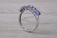 Load image into Gallery viewer, 7 stone natural Tanzanite eternity ring, oval cut Tanzanite set in 9ct white gold, one and half carats Tanzanite
