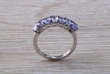 Load image into Gallery viewer, 7 stone natural Tanzanite eternity ring, oval cut Tanzanite set in 9ct white gold, one and half carats Tanzanite
