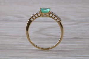 Dainty Oval cut Emerald and Diamond set Yellow Gold Ring