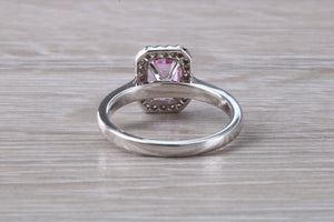One carat Pink Sapphire and Diamond Halo set Ring