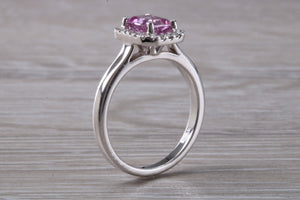 One carat Pink Sapphire and Diamond Halo set Ring