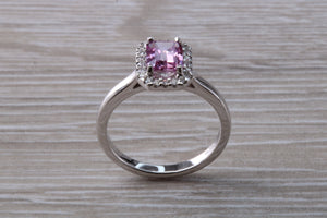 One carat Pink Sapphire and Diamond Halo set Ring