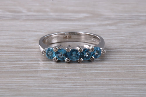 Blue topaz and diamond set ring. 18ct white gold with real diamonds and real topaz