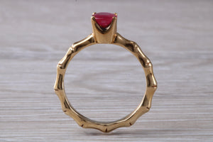 One carat Oval cut Ruby set Tree Branch Solitaire