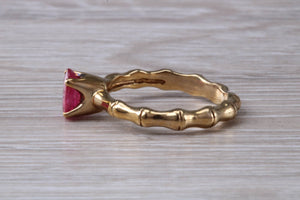 One carat Oval cut Ruby set Tree Branch Solitaire