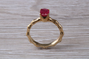 One carat Oval cut Ruby set Tree Branch Solitaire