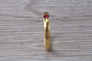 Tension set Natural Ruby Gold Band