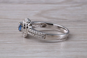 Blue Sapphire and Double Halo set Diamond Ring