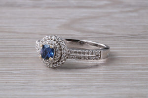 Blue Sapphire and Double Halo set Diamond Ring