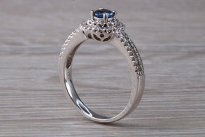 Blue Sapphire and Double Halo set Diamond Ring