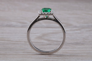 Emerald and Diamond Halo set Platinum Ring