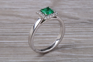 Emerald and Diamond Halo set Platinum Ring
