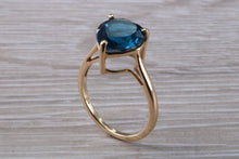 Load image into Gallery viewer, Heart shape London blue Topaz ring made from solid 9ct yellow gold with British hallmark, ideal dress or statement ring