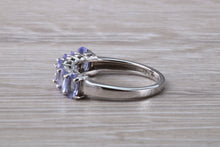 Load image into Gallery viewer, 7 stone natural Tanzanite eternity ring, oval cut Tanzanite set in 9ct white gold, one and half carats Tanzanite