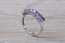 Load image into Gallery viewer, 7 stone natural Tanzanite eternity ring, oval cut Tanzanite set in 9ct white gold, one and half carats Tanzanite