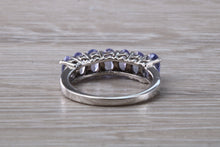 Load image into Gallery viewer, 7 stone natural Tanzanite eternity ring, oval cut Tanzanite set in 9ct white gold, one and half carats Tanzanite