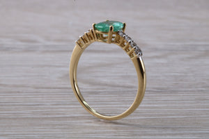 Dainty Oval cut Emerald and Diamond set Yellow Gold Ring