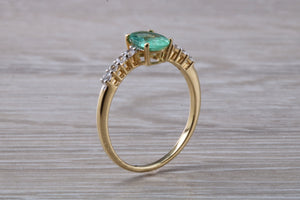 Dainty Oval cut Emerald and Diamond set Yellow Gold Ring